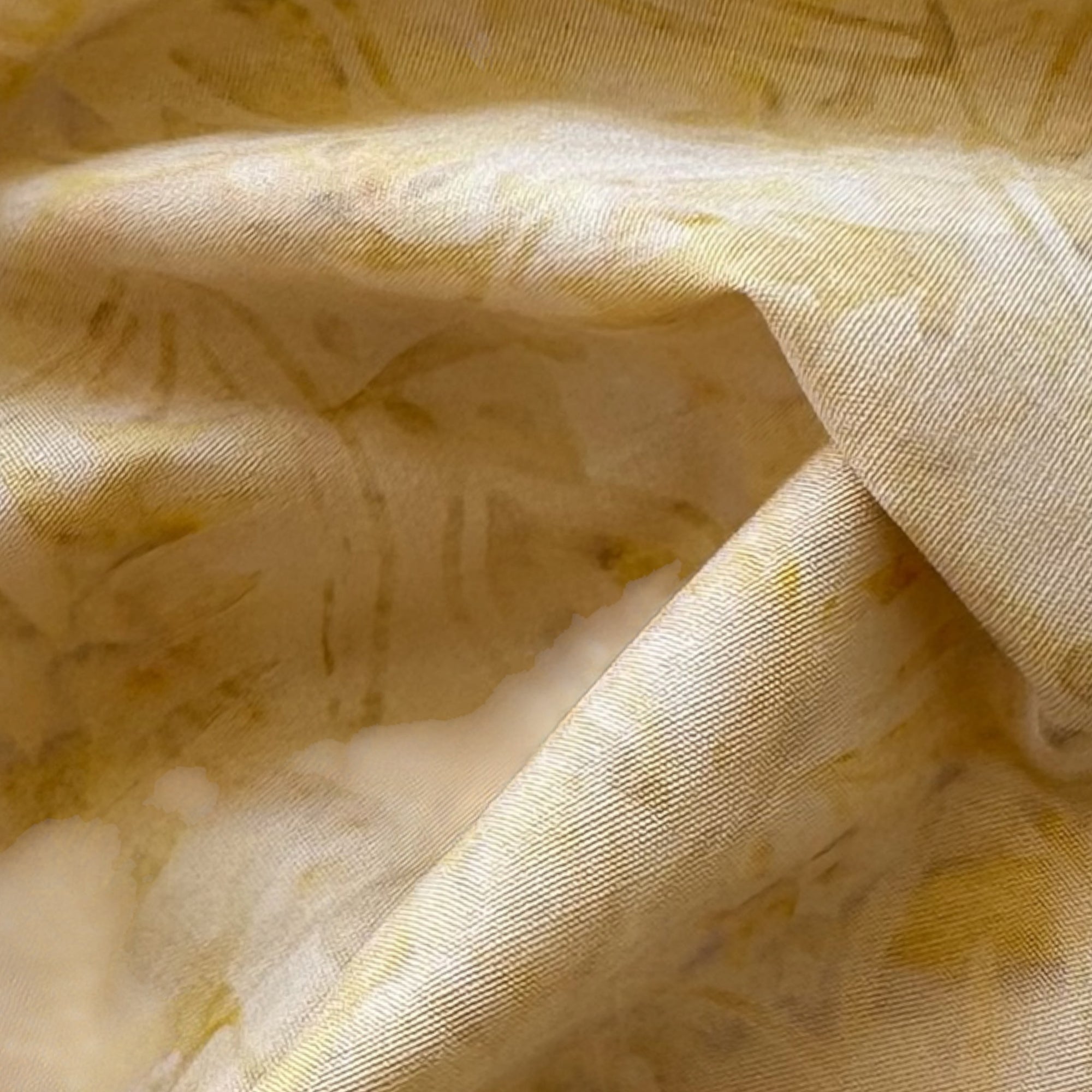 Tela batik liso marmoleado dorado miel
