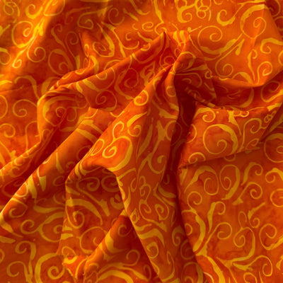 Tela batik espirales naranja y amarillo