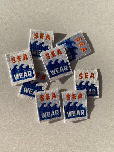 Etiqueta termoadhesiva tejida SEA WEAR